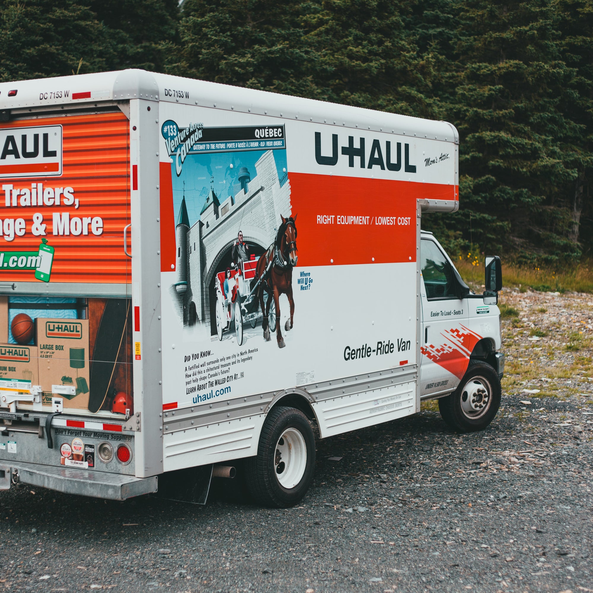 uhaul moving truck parked near some trees
