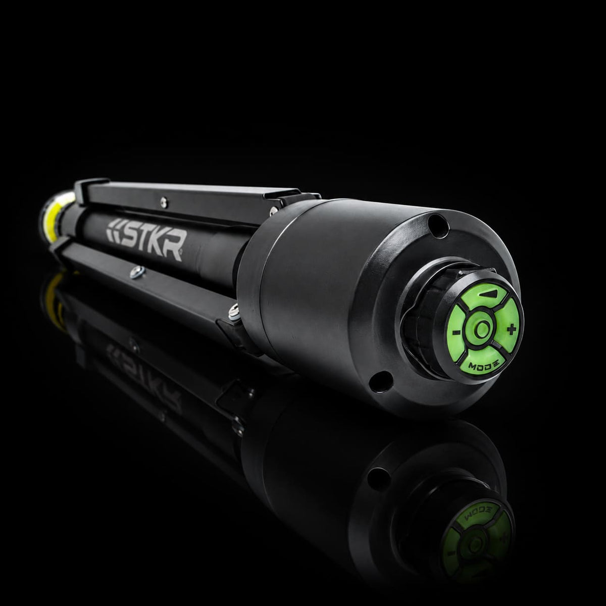 Folded up FLi-Pro Plus 10' Telescoping Area Light. camera focused on the bottom of the tripod showing us the magnetically attached FLi wireless remote..