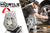Mobile Task Light mobile homepage banner featuring a lifestyle image and a white studio pic. Shown sitting on the ground illuminating man changing a tire on a car. arrow depicting its rotating head.