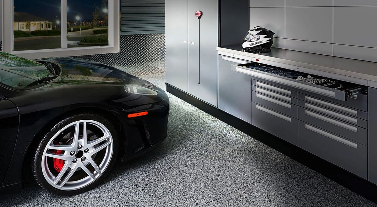 Nice garage with organization. Black car pulled up to an STKR Parking Sensor.