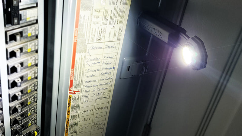 task lighting poster featuring a FLEXIT Pocket Light magnetically attached to a breaker panel